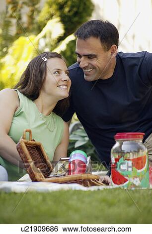 Adult couple at a picnic View Large Photo Image Stock Photograph - Adult couple at a picnic. Fotosearch