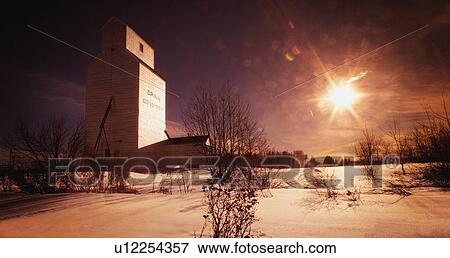 Stock Photo - Agricultural landscape with granary. Fotosearch