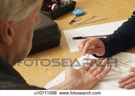 Stock Photo - An occupational therapist at work. Fotosearch