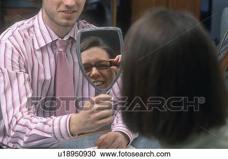 Stock Image - At the optician's. Fotosearch