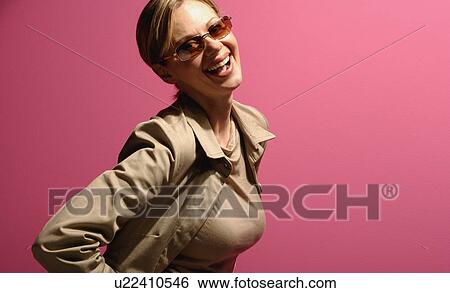 Attractive female wearing sunglasses View Large Photo Image Stock Photograph - Attractive female wearing sunglasses. Fotosearch