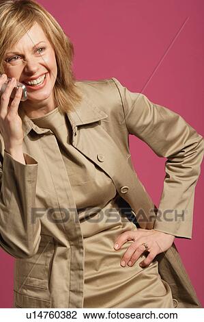 Attractive woman talking on her cell phone View Large Photo Image Stock Image - Attractive woman talking on her cell phone. Fotosearch