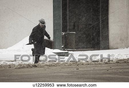 Business man running through slush on street View Large Photo Image Stock Image - Business man running through slush on street. Fotosearch
