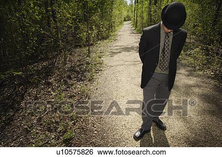 Businessman waiting in a wood View Large Photo Image Stock Photograph - Businessman waiting in a wood. Fotosearch