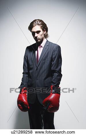 Businessman with fighting gloves View Large Photo Image Stock Photo - Businessman with fighting gloves. Fotosearch
