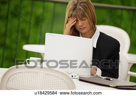 Businesswoman and laptop View Large Photo Image Picture - Businesswoman and laptop. Fotosearch