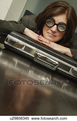 Stock Photography - Businesswoman wearing silly glasses. Fotosearch