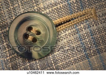 Stock Image - Button and buttonhole. Fotosearch