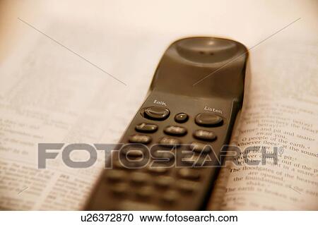 Stock Image - Cell phone and Bible. Fotosearch