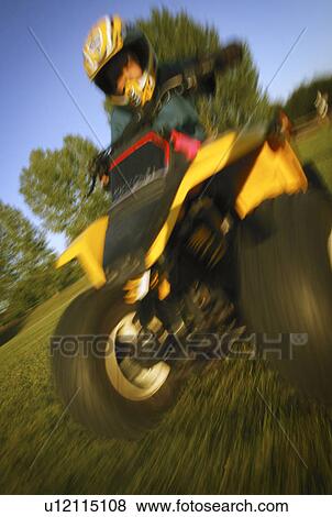 Child on a quad bike View Large Photo Image Stock Photo - Child on a quad bike. Fotosearch