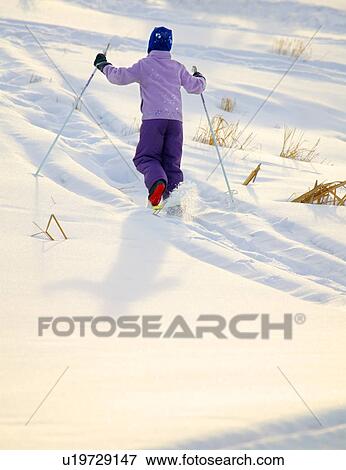Stock Photo - Child on skis. Fotosearch