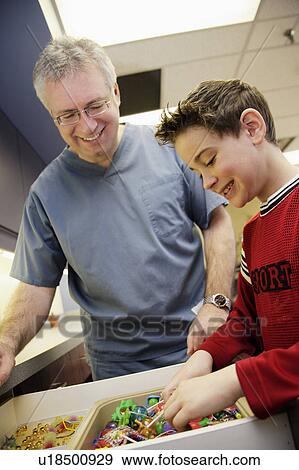 Stock Photo - Child picking prize. Fotosearch