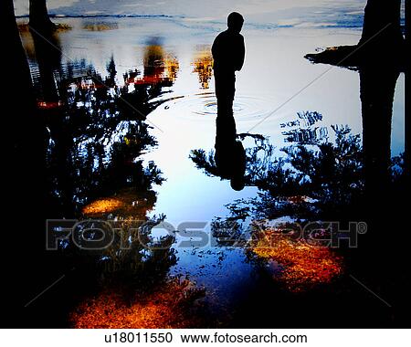Child standing in water which is reflecting all around them View Large Photo Image Stock Image - Child standing in water which is reflecting all around them. Fotosearch