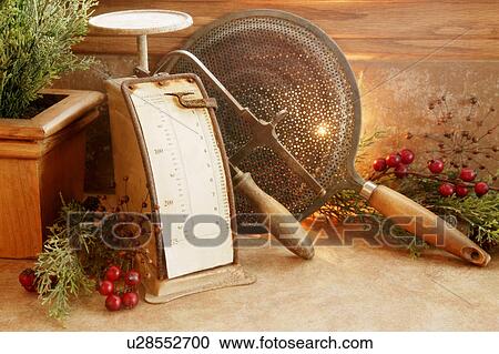 Christmas decorations and old kitchen implements View Large Photo Image Stock Image - Christmas decorations and old kitchen implements. Fotosearch
