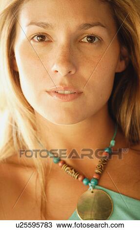 Stock Image - Close up portrait of naturally beautiful woman. Fotosearch