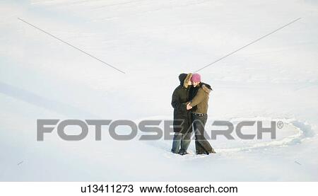 Couple kiss while standing in a heart View Large Photo Image Stock Image - Couple kiss while standing in a heart. Fotosearch