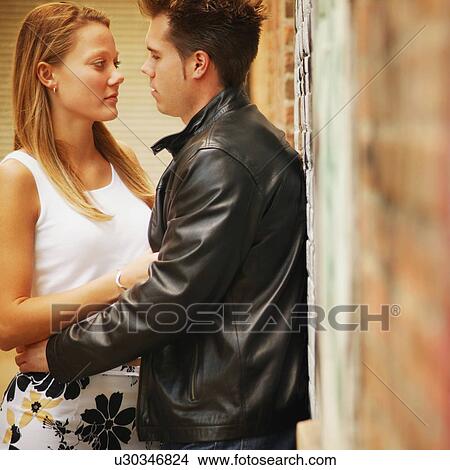 Couple looking at each other View Large Photo Image Picture - Couple looking at each other. Fotosearch