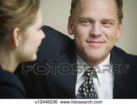 Stock Photograph - Couple meeting together for business and pleasure. Fotosearch