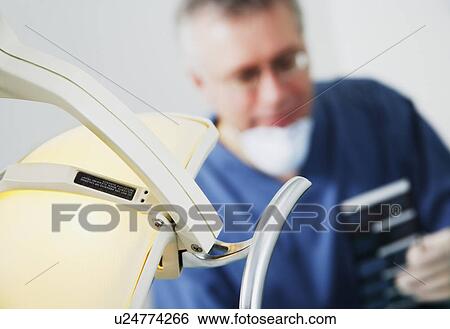 Dentist and light View Large Photo Image Stock Photograph - Dentist and light. Fotosearch