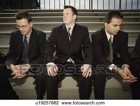 Stock Image - Different to the other businessmen. Fotosearch