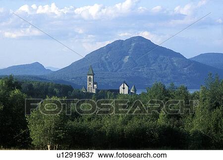 Distant view over trees to a mountain View Large Photo Image Stock Photo - Distant view over trees to a mountain. Fotosearch