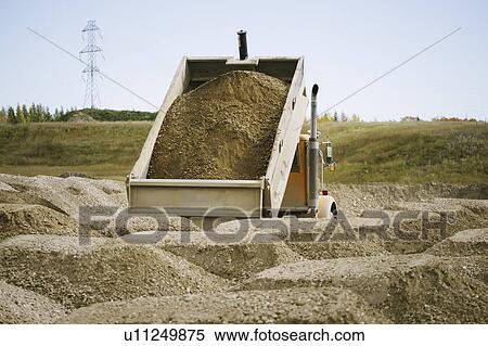 Dumper truck discarding load View Large Photo Image Stock Photography - Dumper truck discarding load. Fotosearch