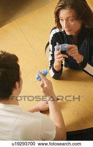 Stock Image - Fingers being stretched. Fotosearch