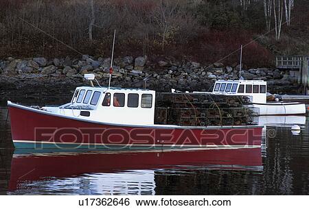 Stock Photograph - Fishing boat with lobster traps. Fotosearch