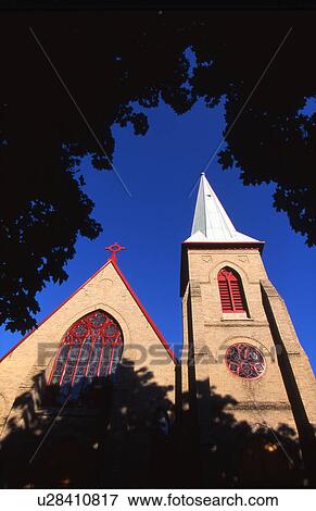 Framed view of a church and bell tower View Large Photo Image Stock Photo - Framed view of a church and bell tower. Fotosearch