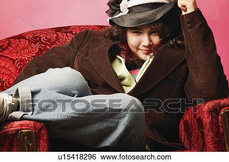 Girl sitting in chair View Large Photo Image Stock Photograph - Girl sitting in chair. Fotosearch