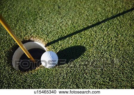 Golf ball close to pin View Large Photo Image Stock Image - Golf ball close to pin. Fotosearch