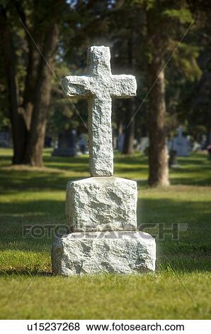 Headstone in graveyard View Large Photo Image Stock Photo - Headstone in graveyard. Fotosearch