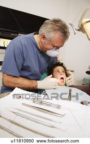 In the dentist's chair View Large Photo Image Stock Image - In the dentist's chair. Fotosearch