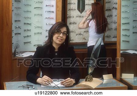Stock Image - Inside the optician's. Fotosearch