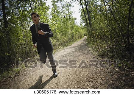 Jogging in a suit View Large Photo Image Stock Photograph - Jogging in a suit. Fotosearch