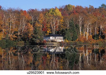 Lakeside house in the fall View Large Photo Image Stock Image - Lakeside house in the fall. Fotosearch