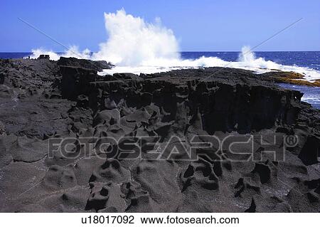 Stock Image - Lava rock near water. Fotosearch
