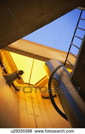 Stock Photo - Looking up through a building to outside. Fotosearch