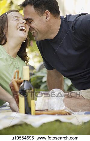 Loving couple eating al fresco View Large Photo Image Stock Photography - Loving couple eating al fresco. Fotosearch