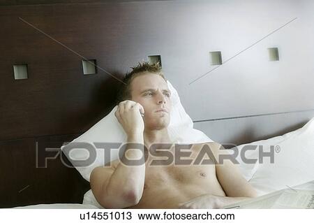 Man in bed View Large Photo Image Stock Image - Man in bed. Fotosearch