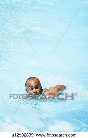 Man in swimming pool View Large Photo Image Stock Photo - Man in swimming pool. Fotosearch