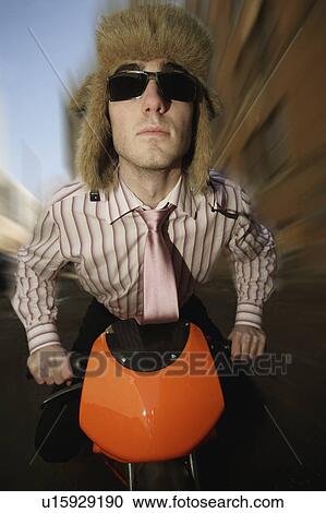 Man on a small motorbike View Large Photo Image Stock Image - Man on a small motorbike. Fotosearch