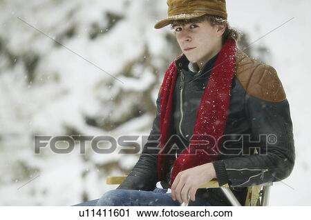 Stock Image - Man sitting on chair. Fotosearch