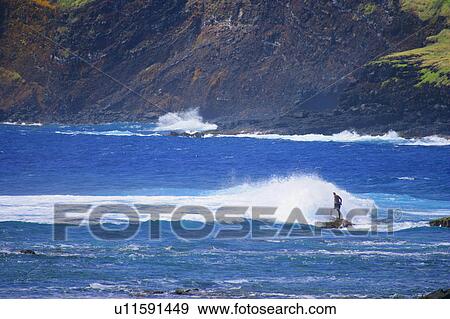 Man standing as wave hits him View Large Photo Image Stock Photo - Man standing as wave hits him. Fotosearch