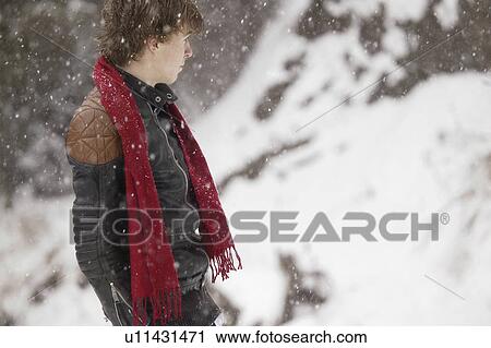 Man stands as it snows View Large Photo Image Stock Image - Man stands as it snows. Fotosearch