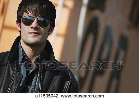 Stock Image - Man wearing sunglasses. Fotosearch