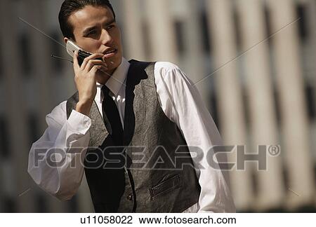 Stock Image - Man with cell phone. Fotosearch