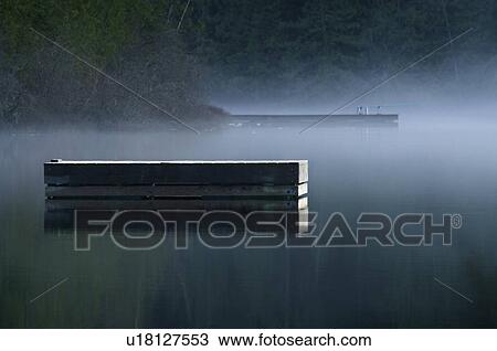 Stock Image - Misty lake. Fotosearch