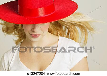Model wearing fashionable red hat View Large Photo Image Picture - Model wearing fashionable red hat. Fotosearch