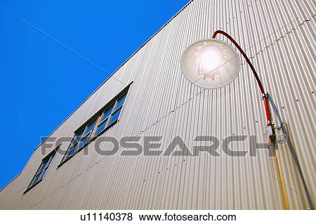 Stock Photo - Modern industrial building with outside light. Fotosearch